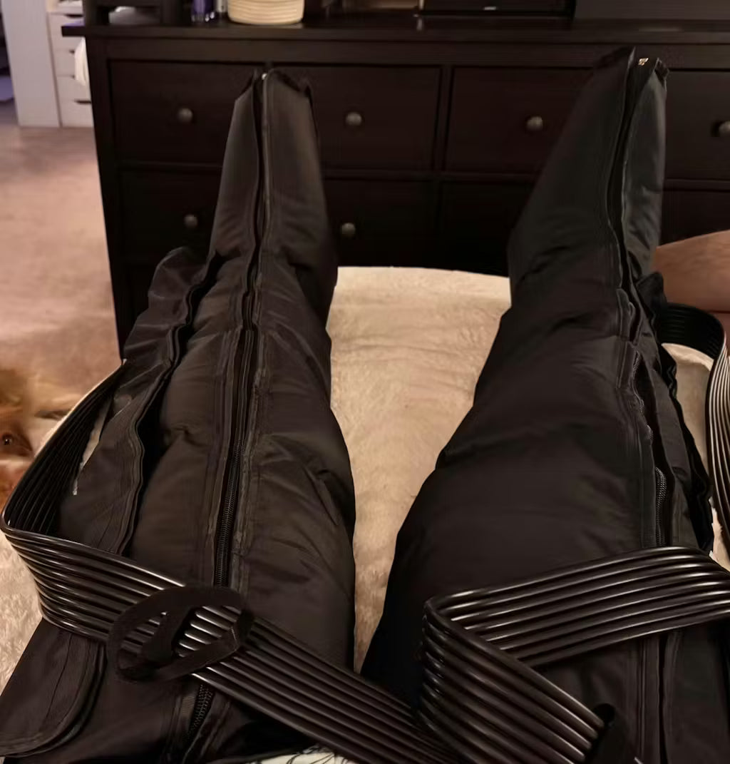 Person wearing Darth Vader costume with a dog in the background